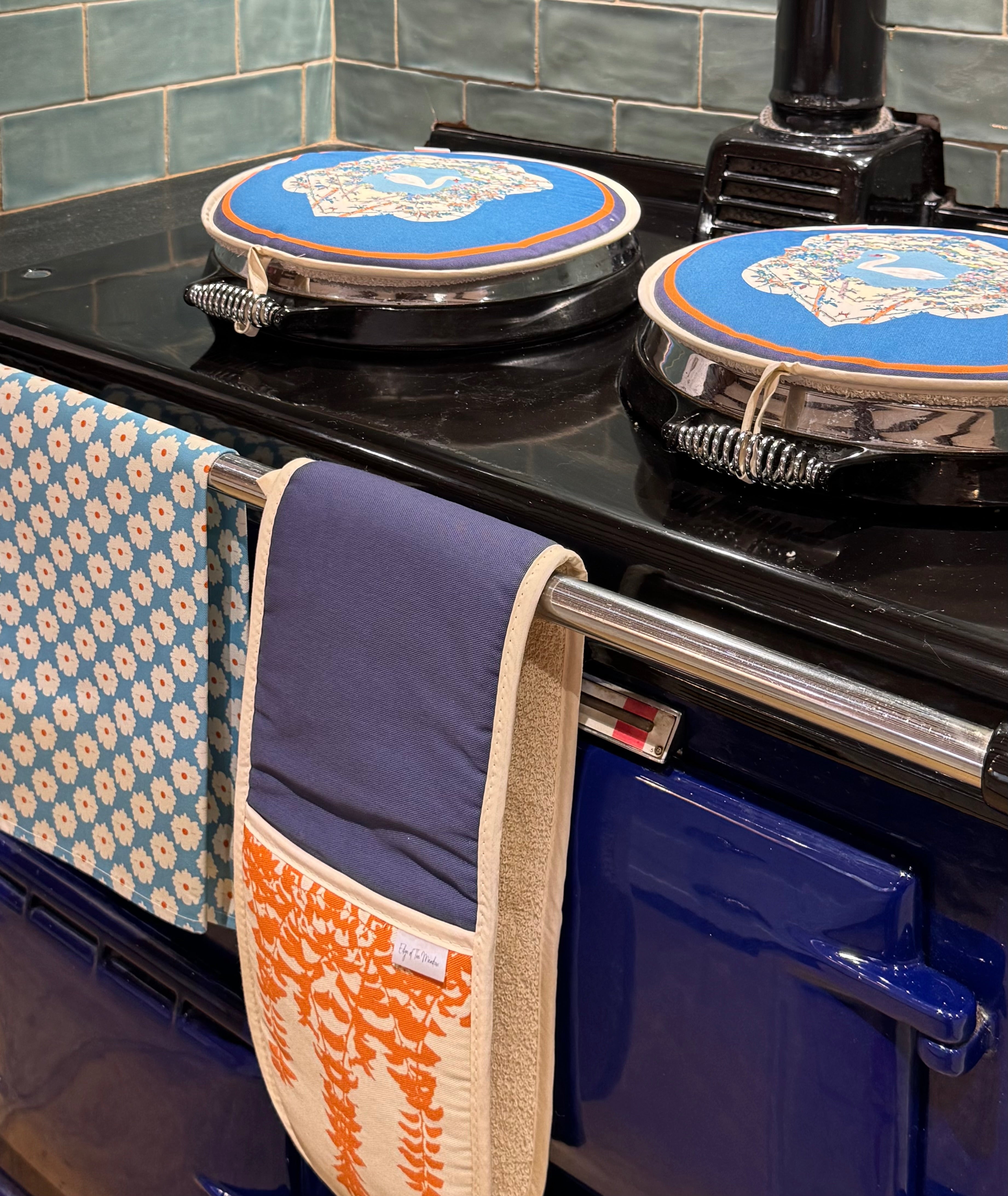 Hob Covers, Tea Towel And Oven Gloves displayed on AGA 